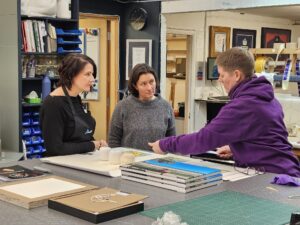 Jo discussing measuring of textiles and canvases