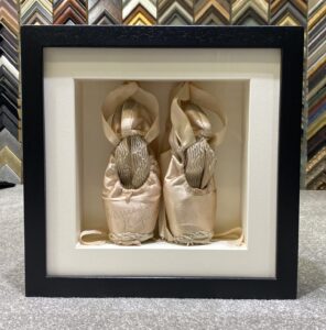 Signed ballet shoes on pointe in a hand painted box frame